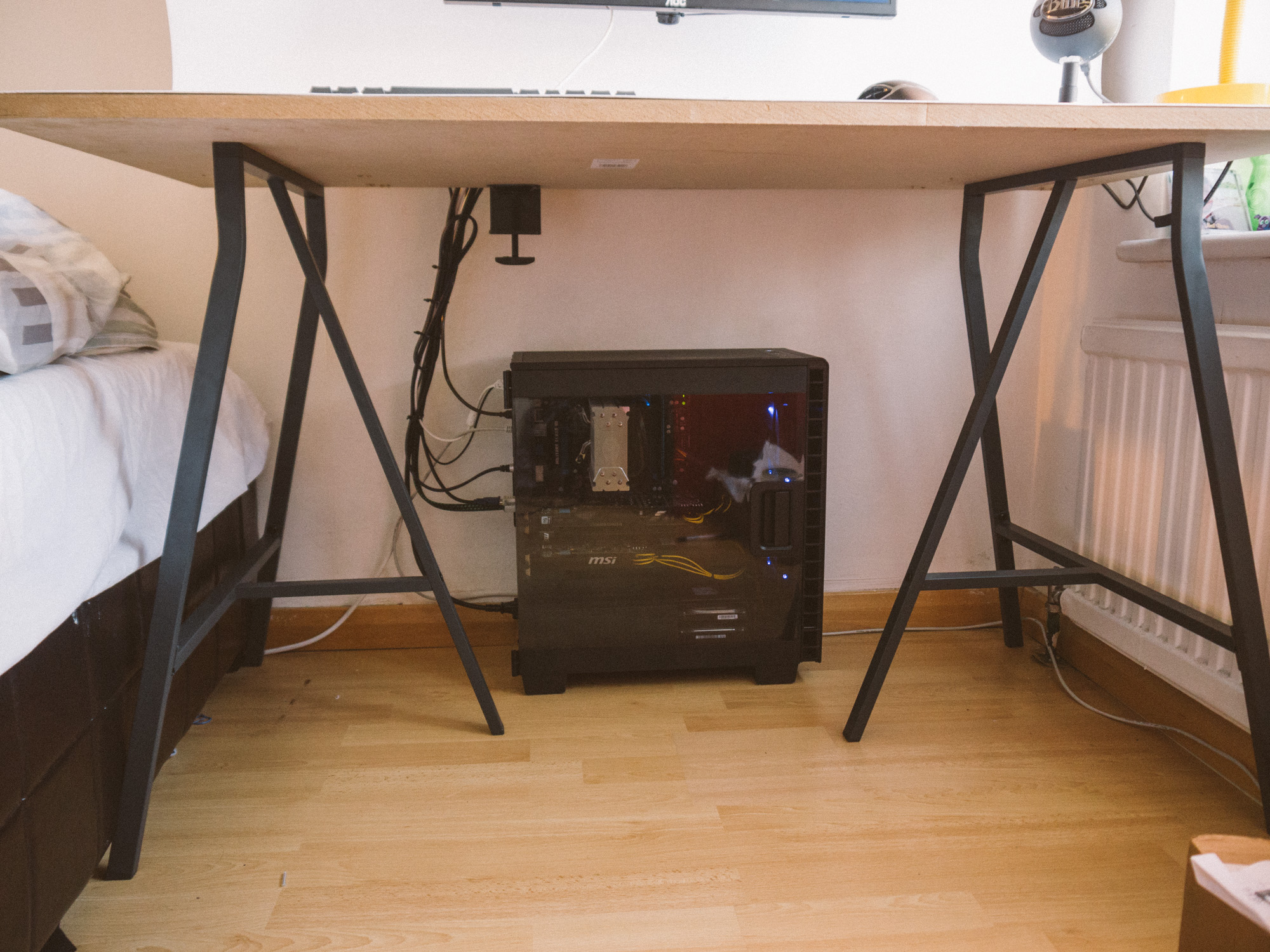 A gaming pc, under the desk with neat cable management