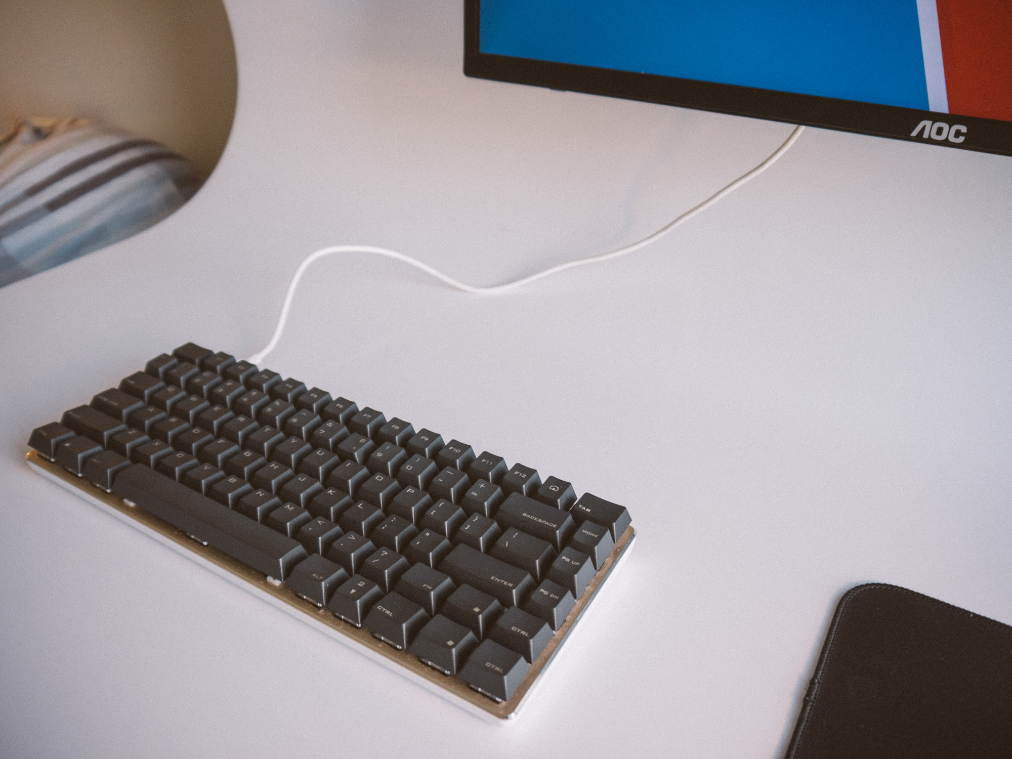 close up of the mechanical keyboard in 84 key layout and with dark grey keycaps