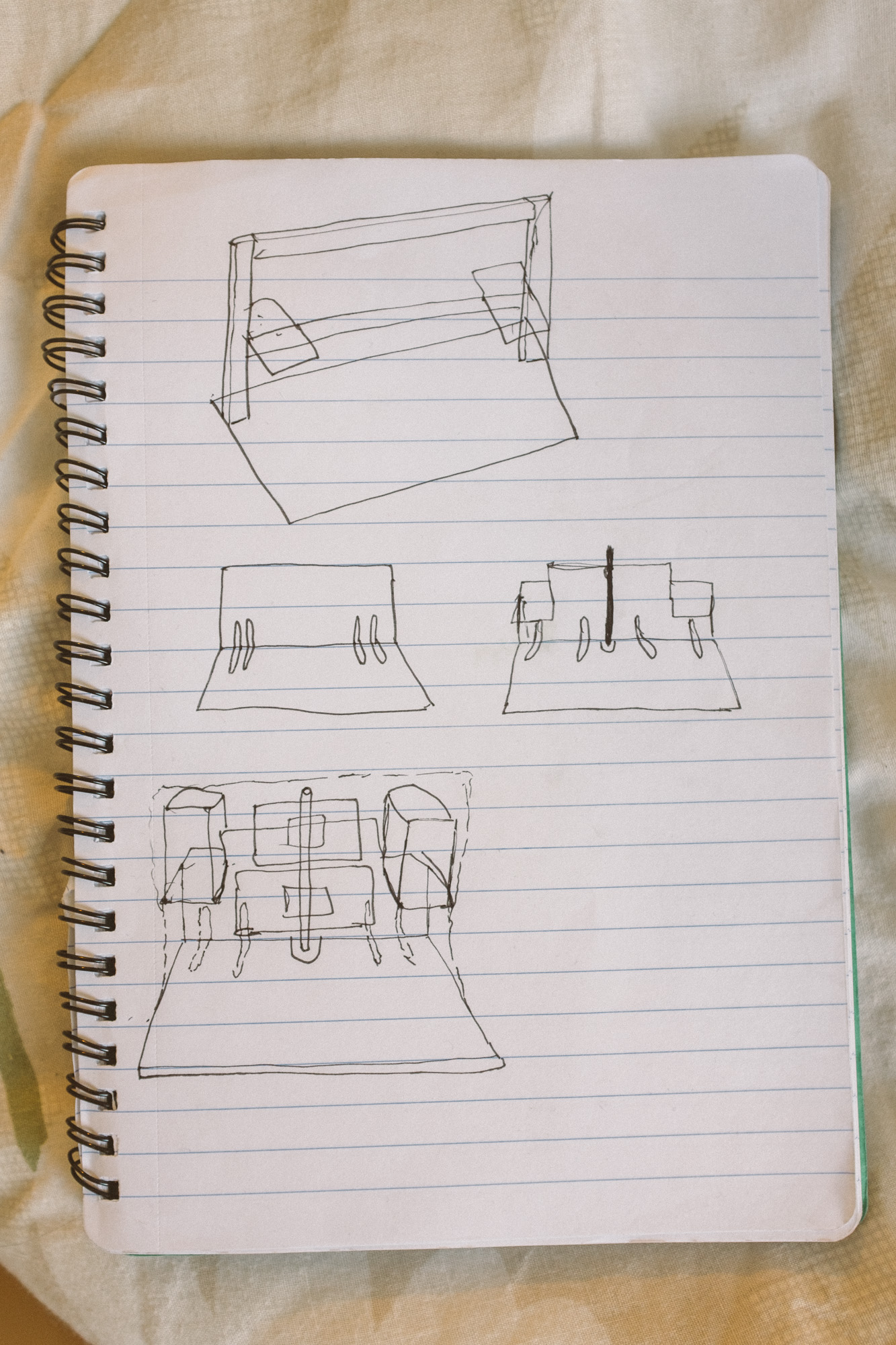 Notebook with very basic sketches of the desk design and how it would be constructed