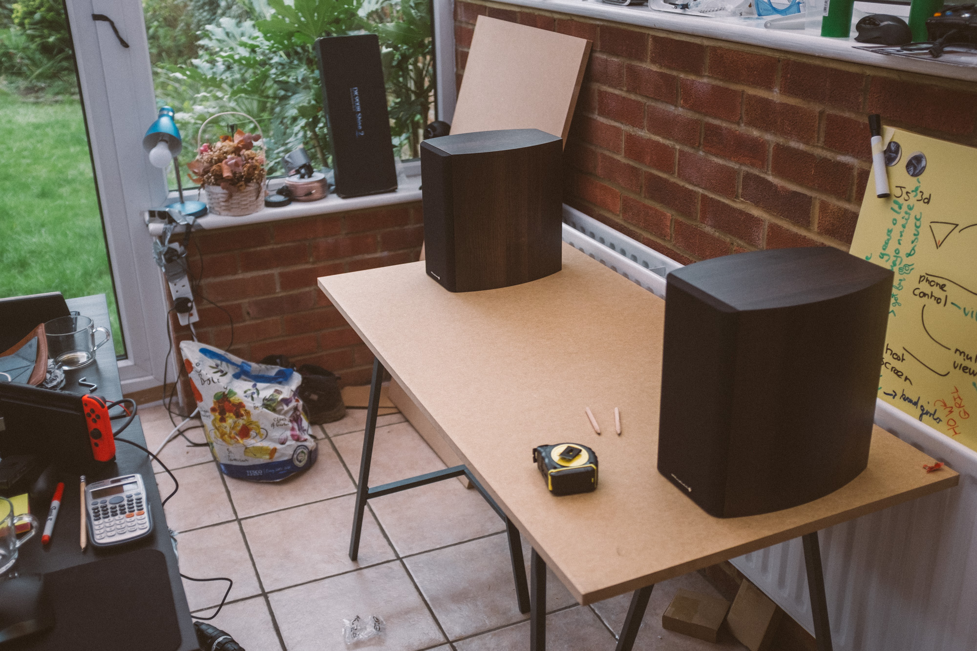 Speakers placed on an MDF sheet, placed on the trestles