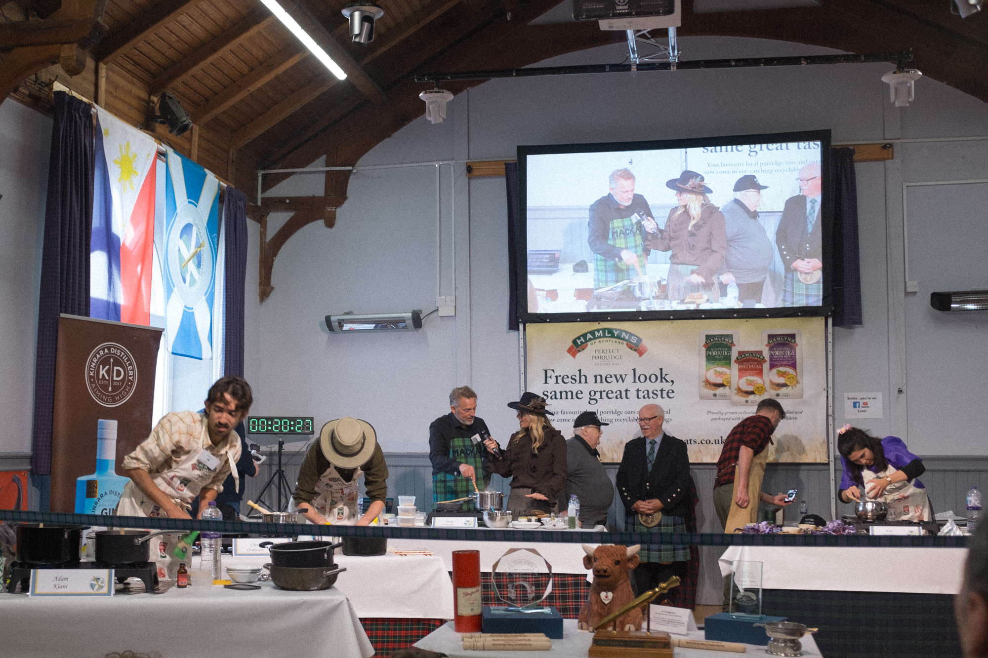 Competitors cooking porridge for the first round