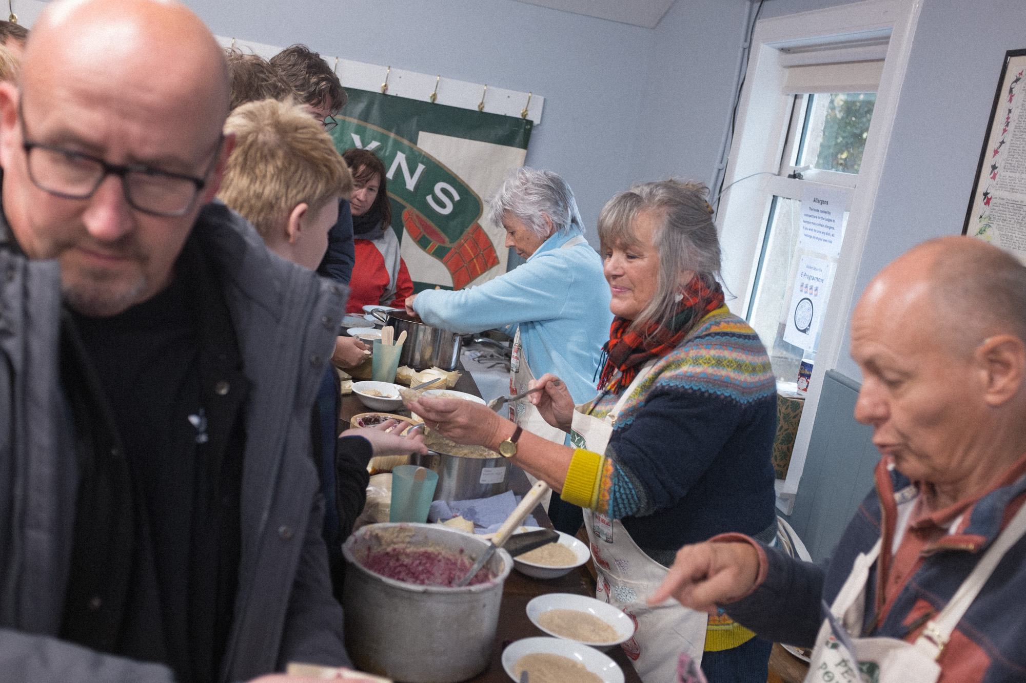 Spectators getting to taste the porridge that was made
